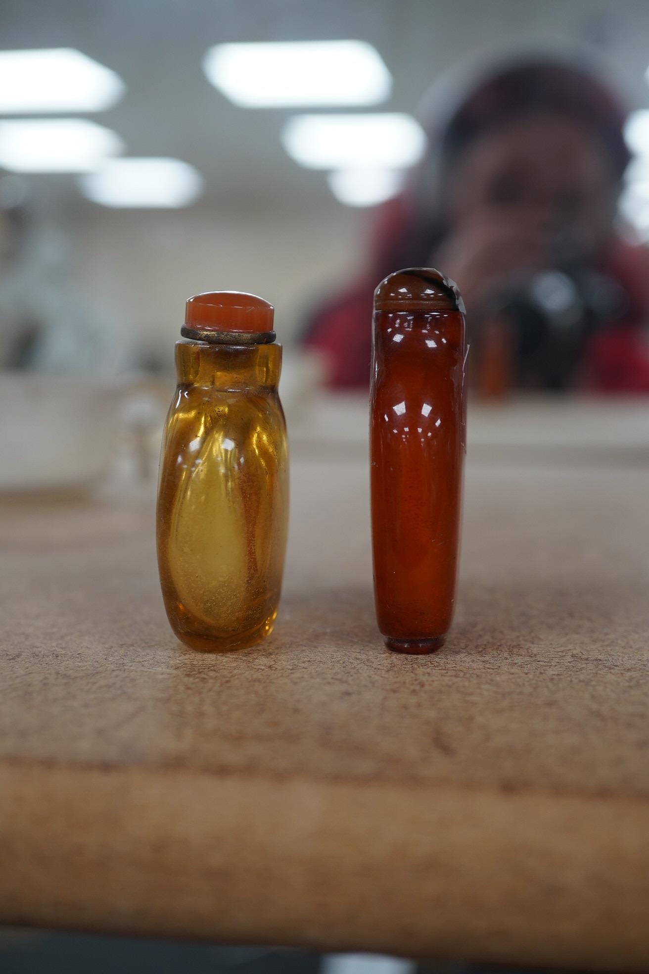 Two Chinese snuff bottles, amber and orange glass, and a similar bowenite bowl, 8cm. Condition - fair